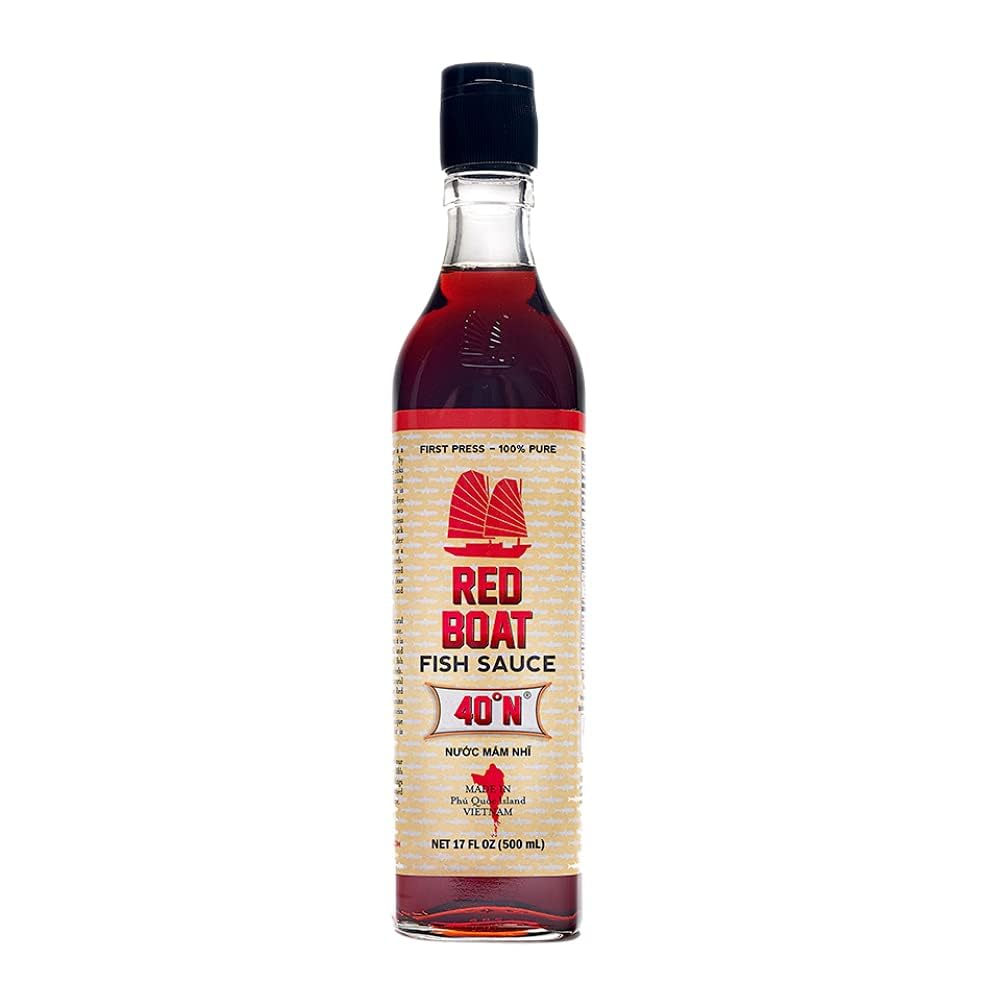Red Boat fish sauce bottle on a kitchen counter highlighting authentic umami flavor.