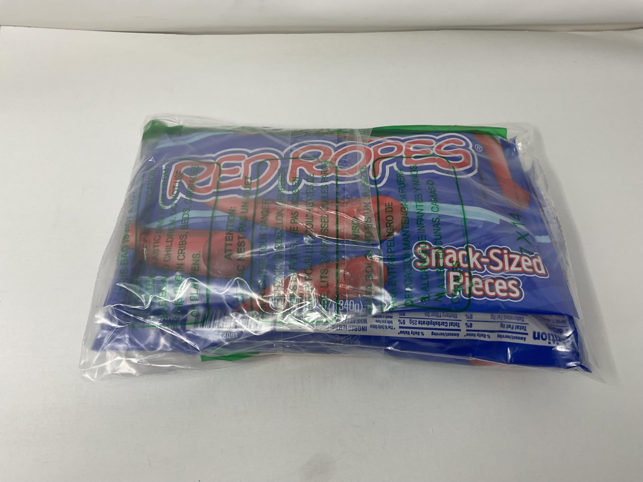 Single Red Vines Red Ropes bite highlighting chewy texture