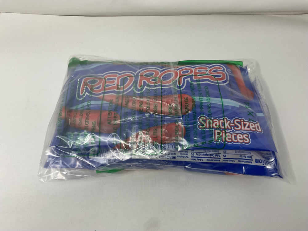Single Red Vines Red Ropes bite highlighting chewy texture