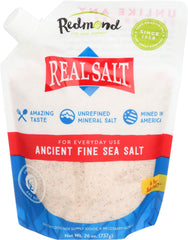 Redmond Real Salt ancient fine sea salt pours, highlighting delicate sweetness for cooking.