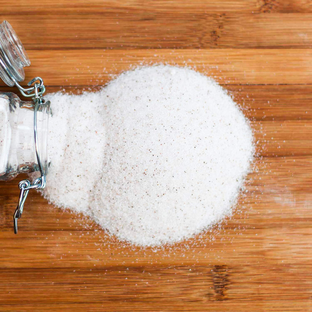 Redmond Real Salt on kitchen counter evokes everyday flavor enhancement for vegetables and meats