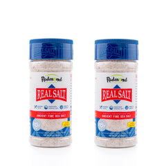 Redmond Real Sea Salt shaker 2-pack on kitchen counter for everyday seasoning.