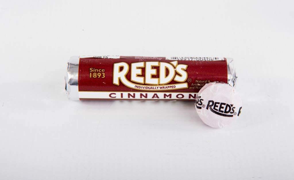 Close-up of Reed’s Cinnamon Candy Roll showing seven wrapped pieces.