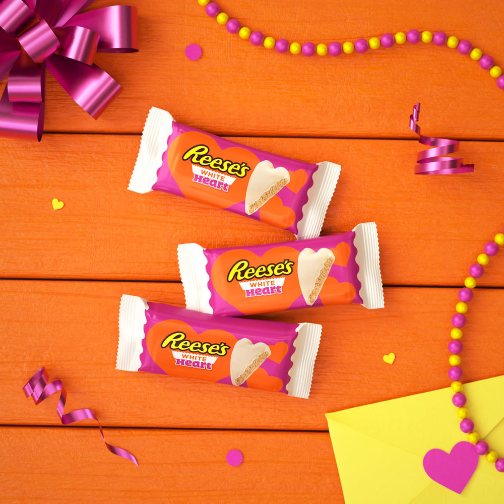 Reese's candy bowls filled with white creme peanut butter hearts for sharing