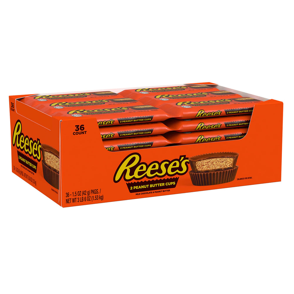 REESE'S cups closeup: creamy peanut butter center under smooth milk chocolate.
