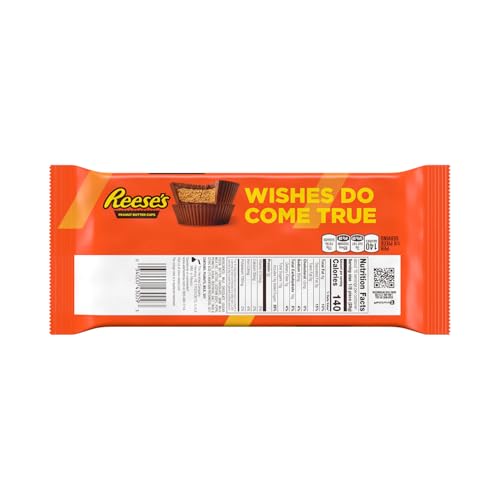 REESE'S Milk Chocolate Peanut Butter Cup Bar closeup emphasizes glossy milk chocolate coating.