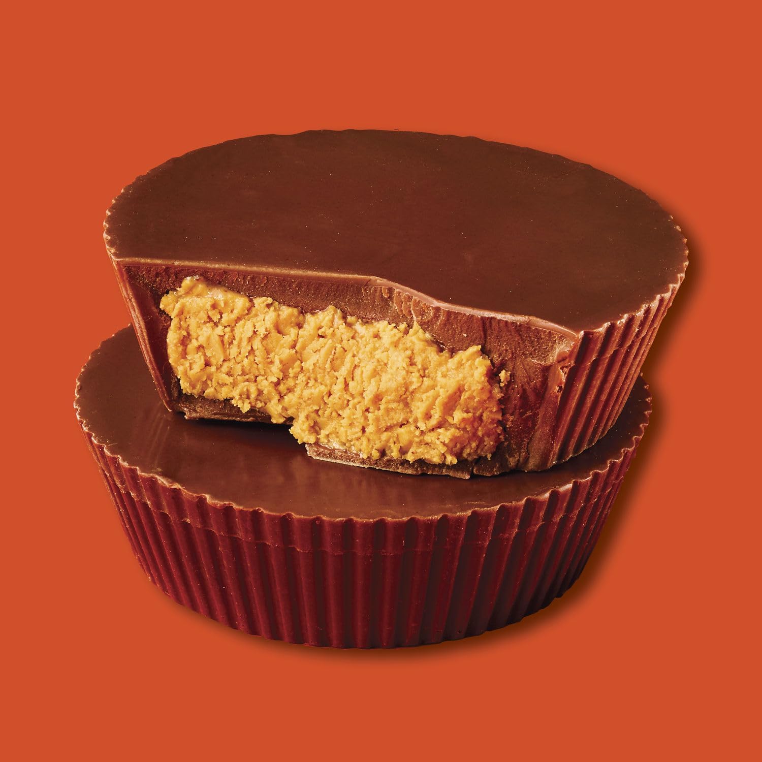 Close-up of Reese's peanut butter cups with creamy milk chocolate coating