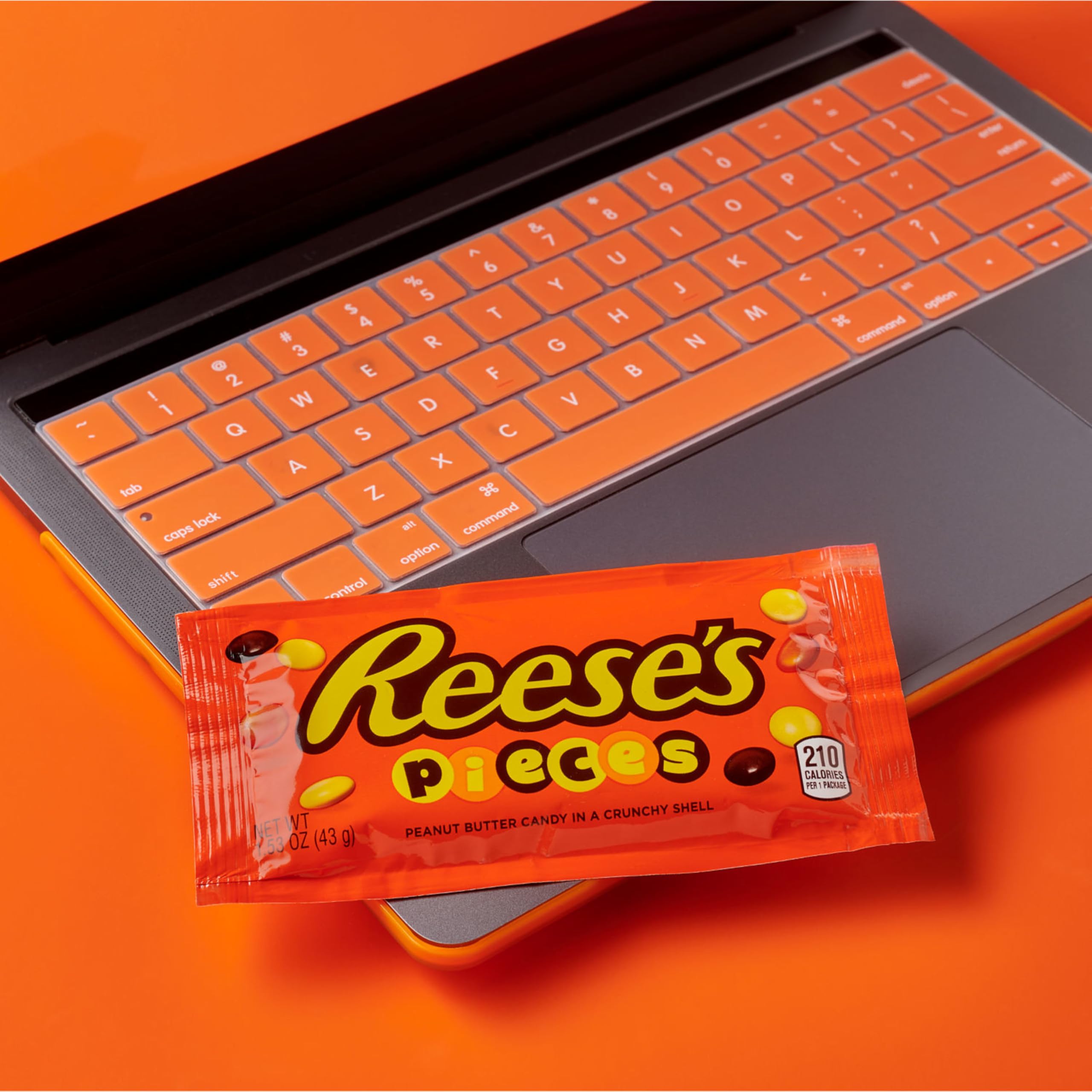Macro view of Reese's Pieces peanut butter center inside a crunchy shell