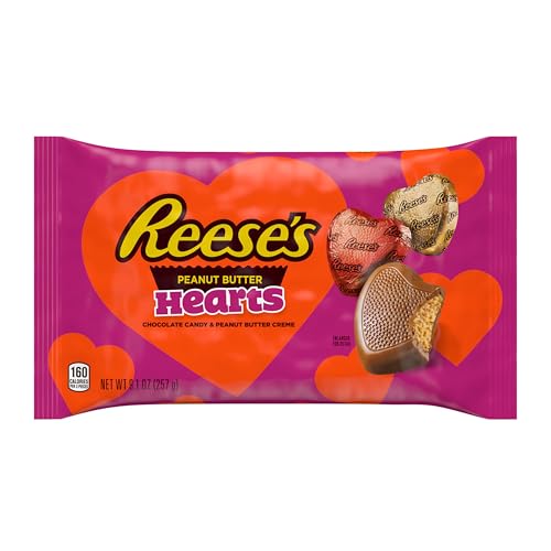 Valentine gift presentation: Reese's Hearts with card and flowers.
