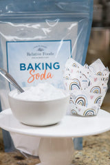 Relative Foods Baking Soda bulk container on pantry shelf, all-purpose cleaner.