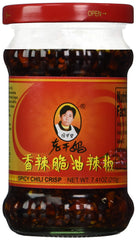 Ren Dao Mei spicy chili crisp bottle enhances noodles with rich, smoky heat.