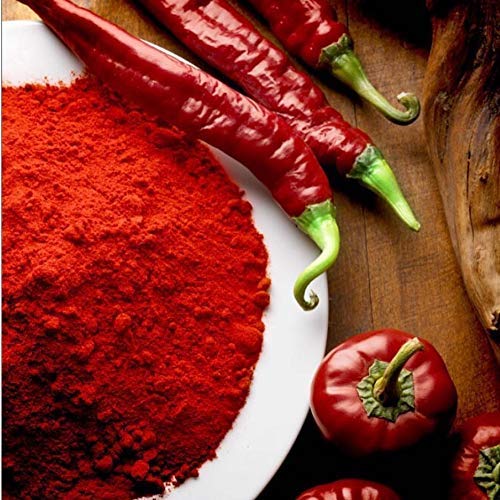 REY DE LA VERA sweet paprika tin label with traditional print.