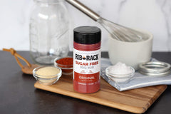Rib Rack Original Sugar Free BBQ Rub graces grilled meats with balanced, savory flavor.