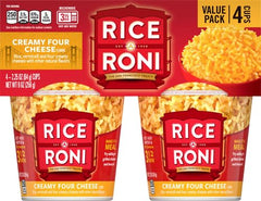 Creamy cheese sauce closeup on Rice-A-Roni cup for rich flavor
