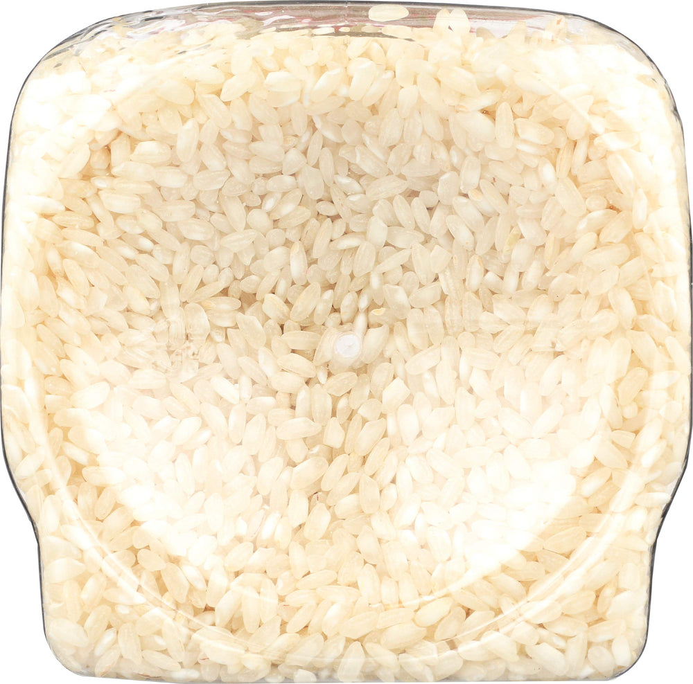 RiceSelect rice jar on kitchen shelf showing non-GMO and gluten-free benefits.