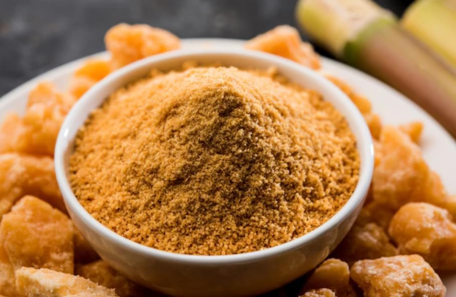 Rigel Spices Cane Jaggery Powder pouring action highlights rich caramel aroma.