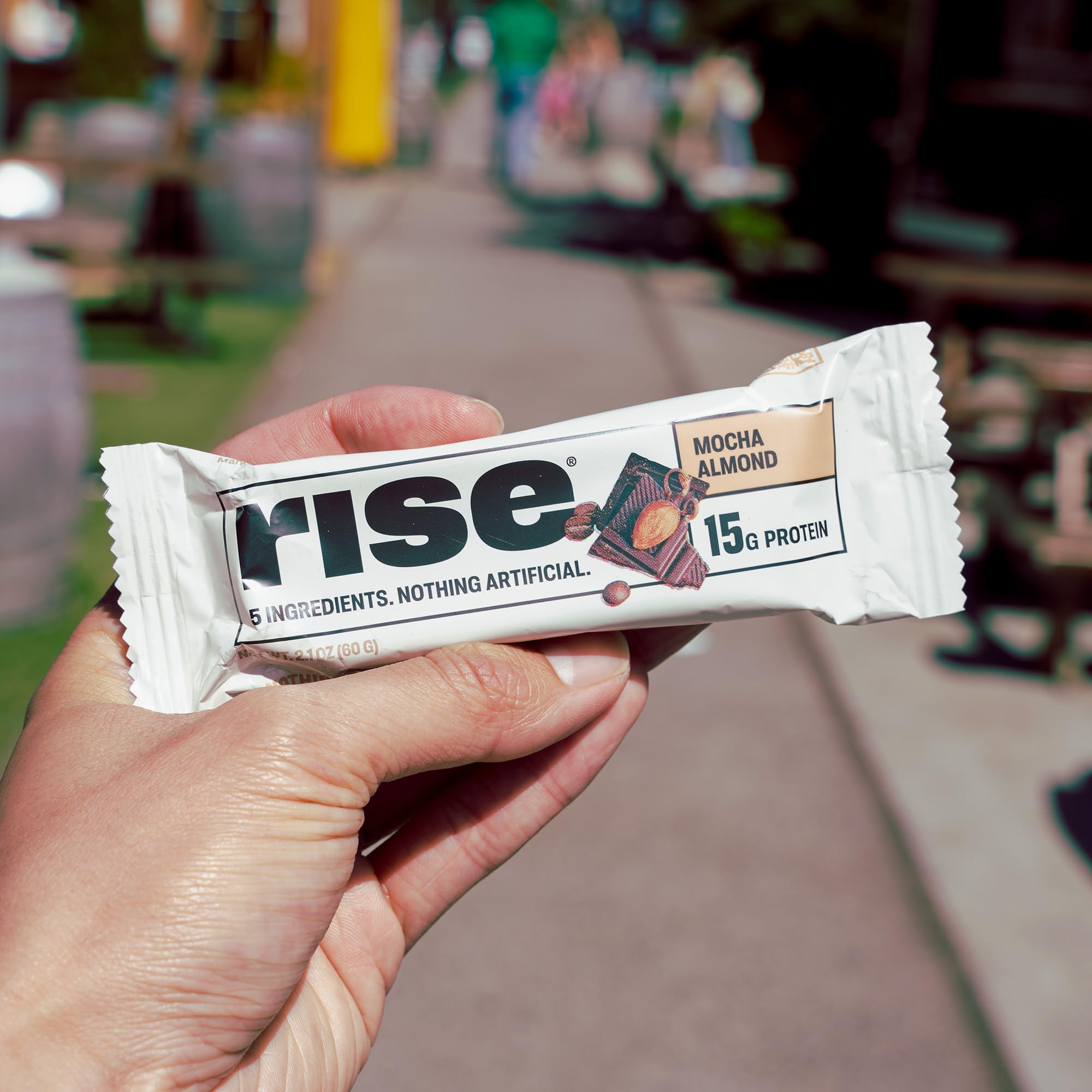 Rise Mocha Almond bar on gym bag after workout.
