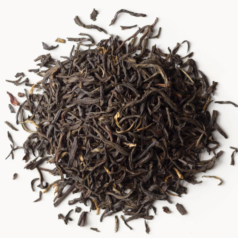 Rishi Tea China Breakfast amber infusion in glass highlighting caramel notes