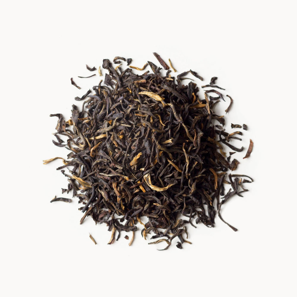 Rishi Tea Golden Yunnan packaging highlights organic sourcing and quality