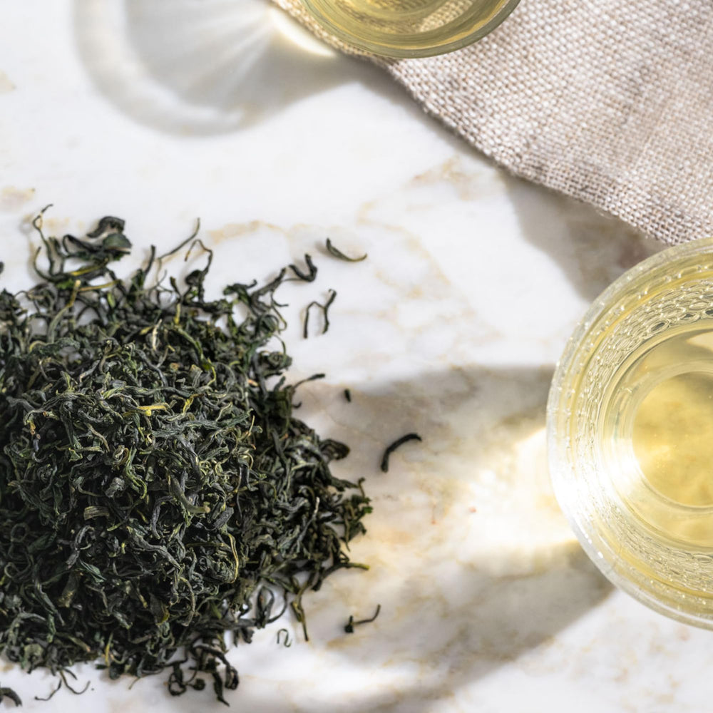 Rishi Tea Jade Cloud green tea infusion in glass for hot or iced refreshment.