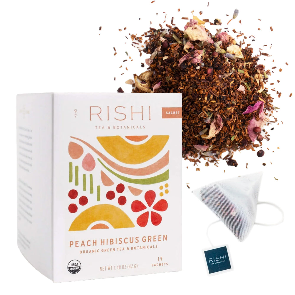 Rishi Tea Peach Hibiscus Green Houjicha sachet in cup ready to steep, low caffeine