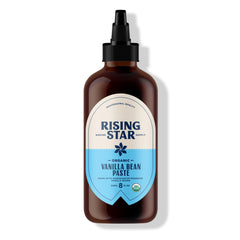 Rising Star Vanilla Paste bottle closeup shows rich aroma and vanilla specks.