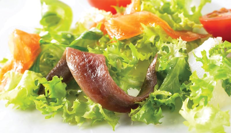 Roland anchovies poured over pasta for a quick flavor boost