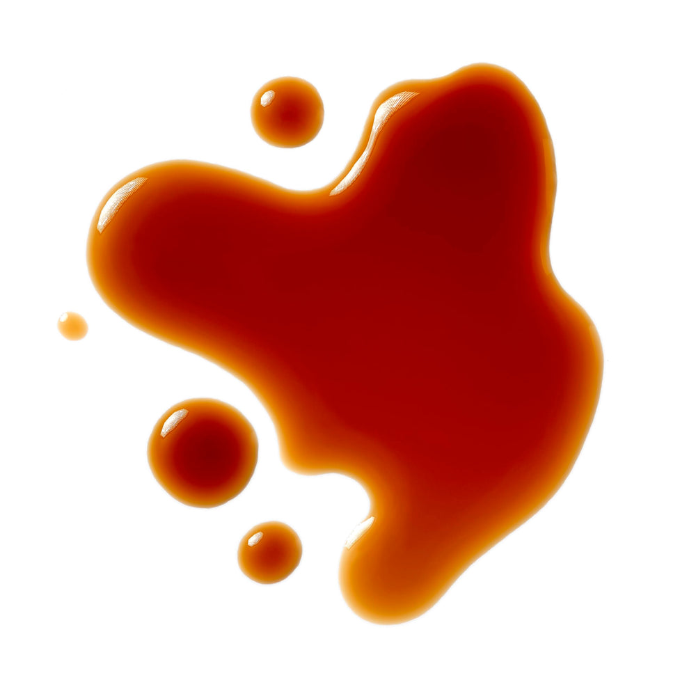 Roland Foods Black Vinegar pour in a glass suggests smoky, tangy notes for sauces.