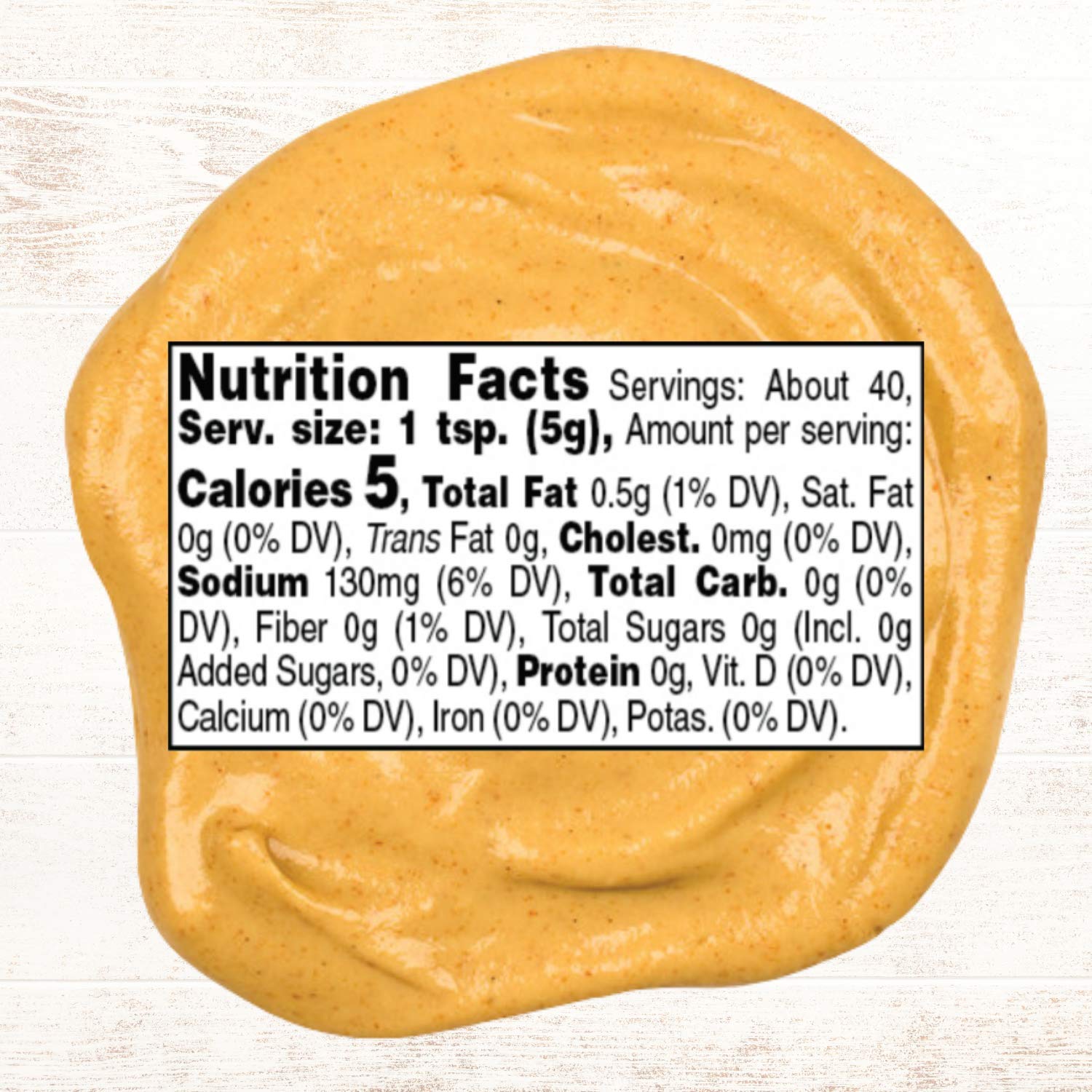 Roland Foods Dijon mustard bottle close-up highlighting smooth texture for dressings.