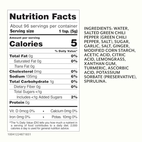 Roland Foods Green Sriracha bottle pour demonstrates smooth drizzle over noodles.