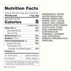 Roland Foods Green Sriracha bottle pour demonstrates smooth drizzle over noodles.
