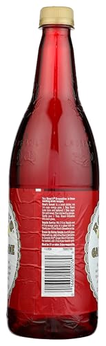 Rose's Grenadine bottle beside a crafted cocktail for modern mixology.