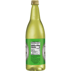 Rose's Lime Juice being poured into a glass for cocktails