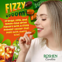 Roshen Fizzy Boom candy display of orange, cola, and lemon-lime flavors