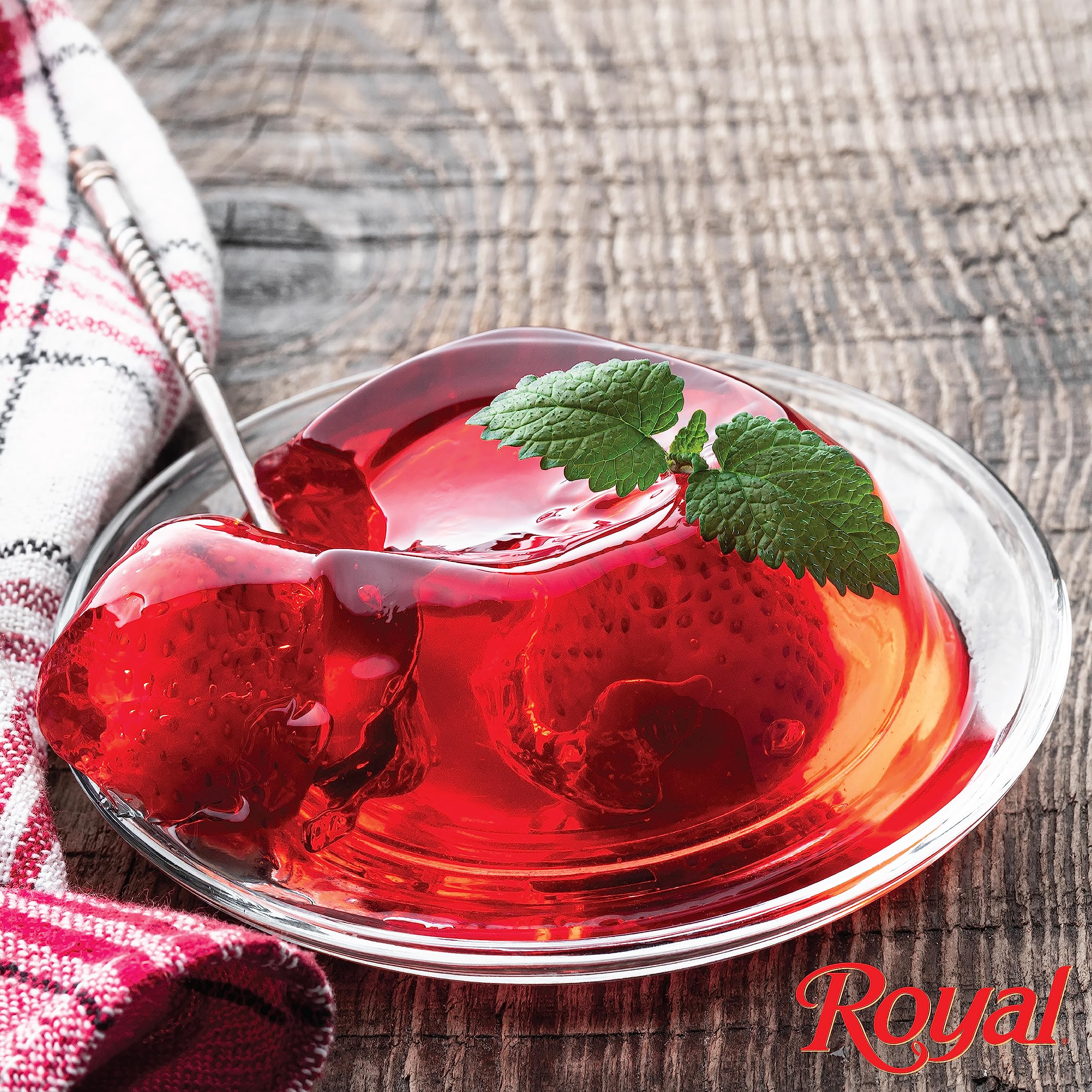Royal Strawberry Gelatin Dessert Mix dissolving in cold water to set quickly.