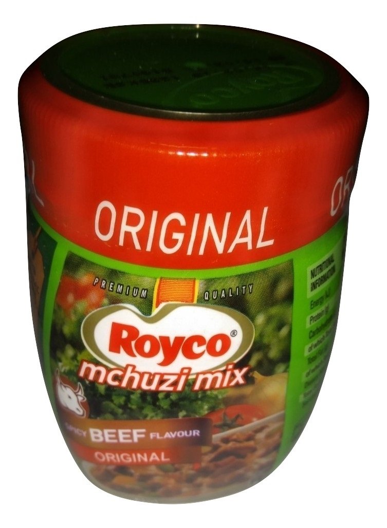 Royco Mchuzi Mix pouring action capturing aroma enhancement when seasoning meat and vegetables.