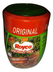 Royco Mchuzi Mix pouring action capturing aroma enhancement when seasoning meat and vegetables.