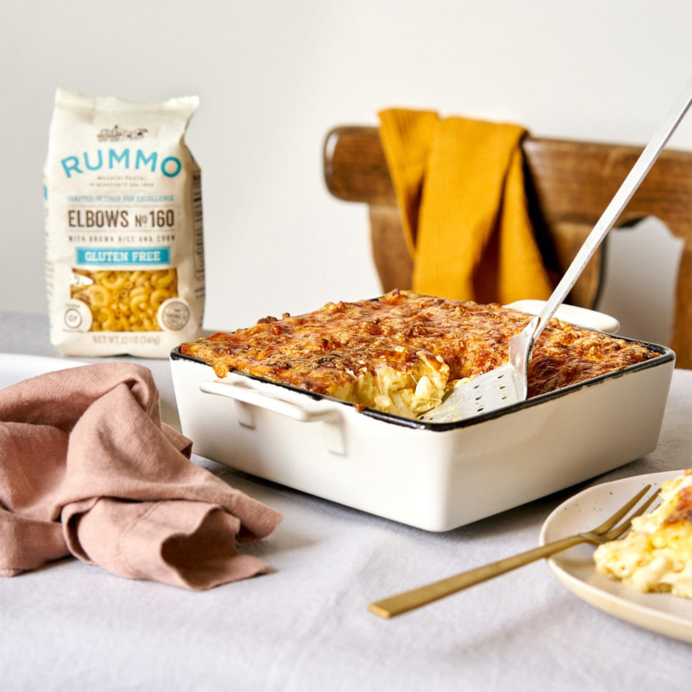 Rummo elbows pasta texture with sauce, inviting forkfuls and satisfying bite.