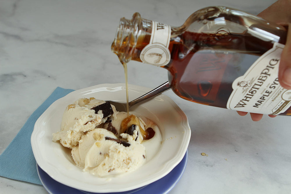Runamok WhistlePig maple syrup drizzled on ice cream creates indulgent flavor.