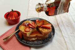 Runamok WhistlePig maple syrup on pancakes highlights versatile topping.