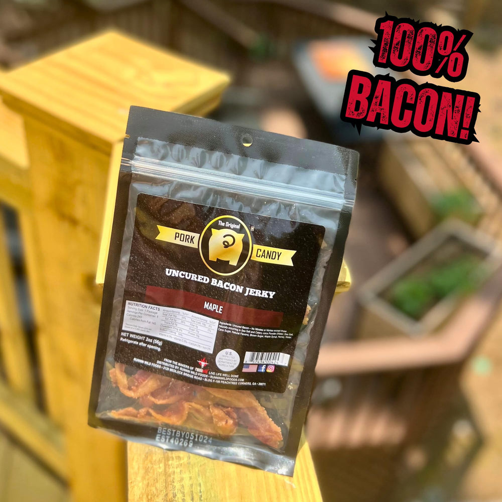 Two bags of RunninWild maple bacon jerky on a wooden board