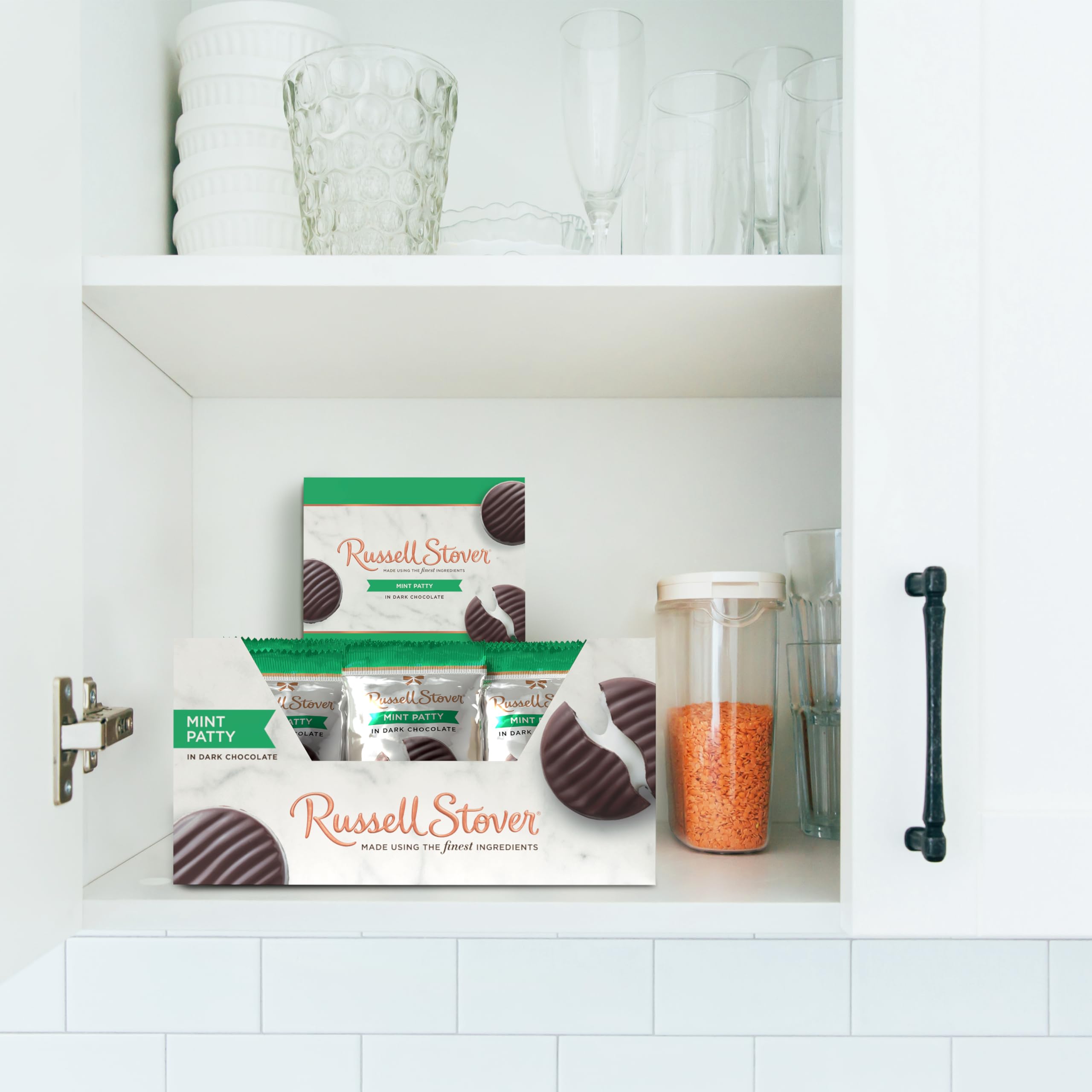 Hand holding Russell Stover dark chocolate mint patty for a quick treat