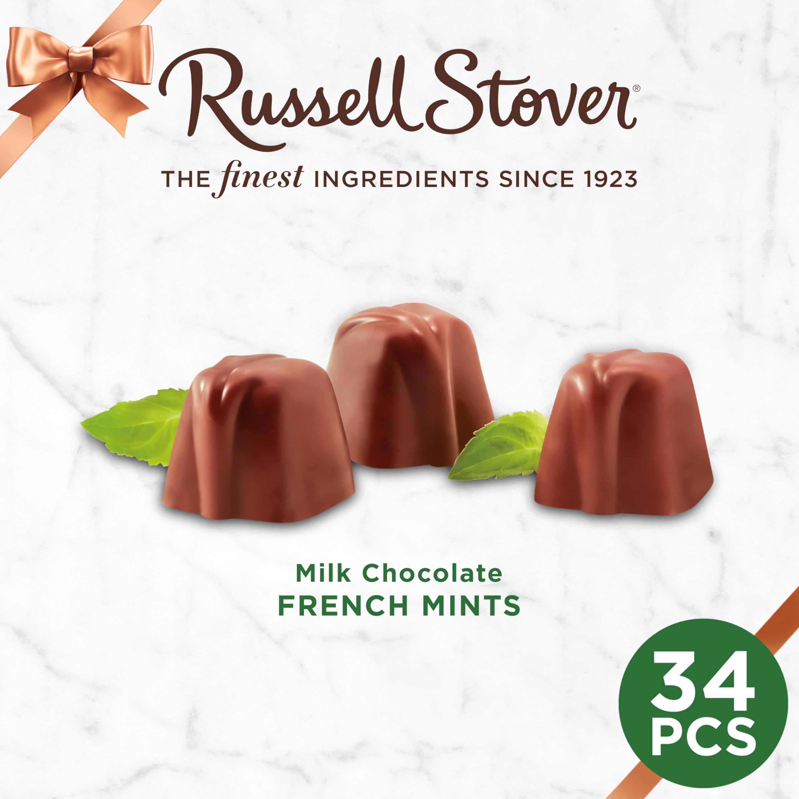 RUSSELL STOVER Milk Chocolate mints in hand suggest shareable treats and indulgent snacking.