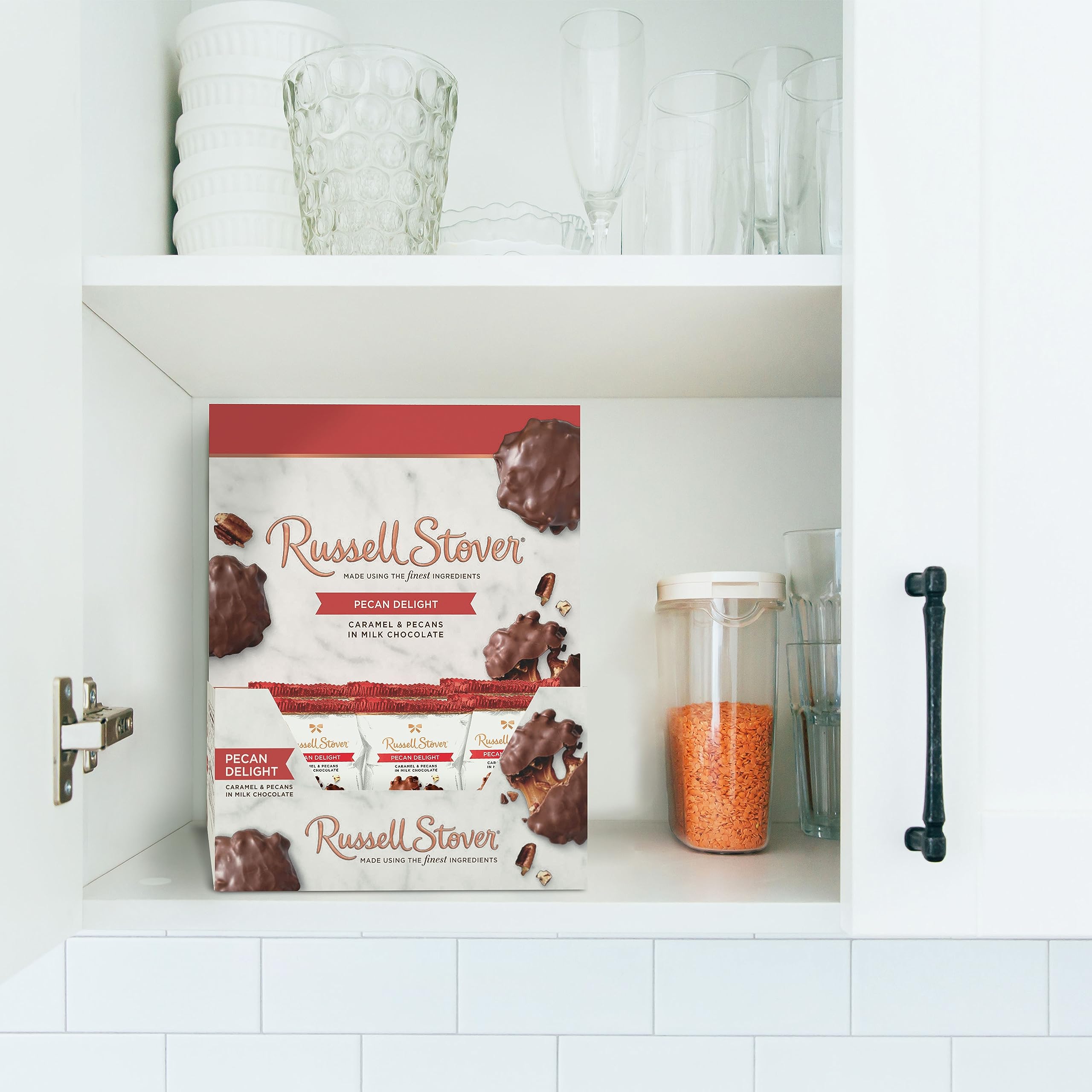 Open piece of Russell Stover Pecan Delight showing layered caramel and chocolate