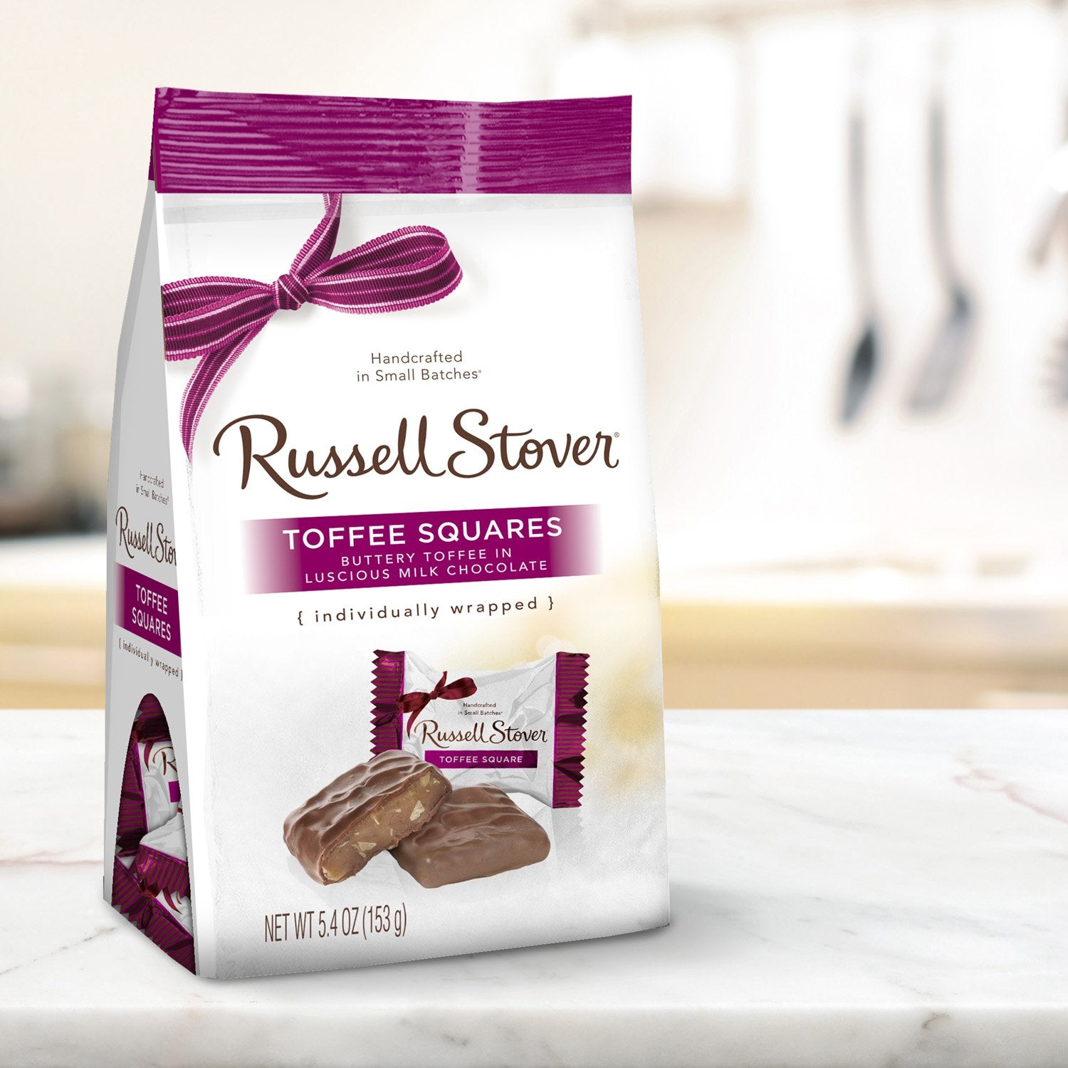 Russell Stover toffee squares on a plate, shareable party favor.