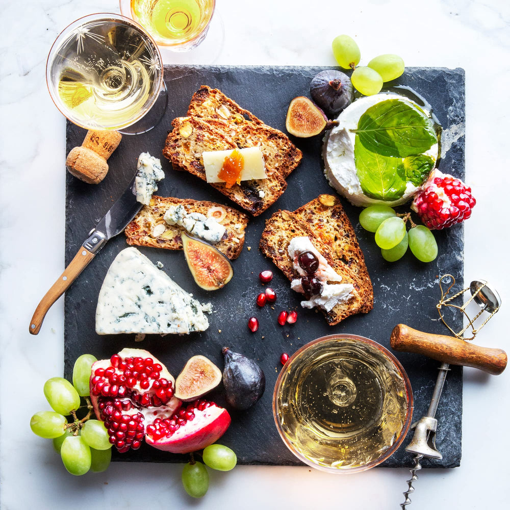 Rustic Bakery tart cherry cacao nib almond crackers beside cheese and fruit