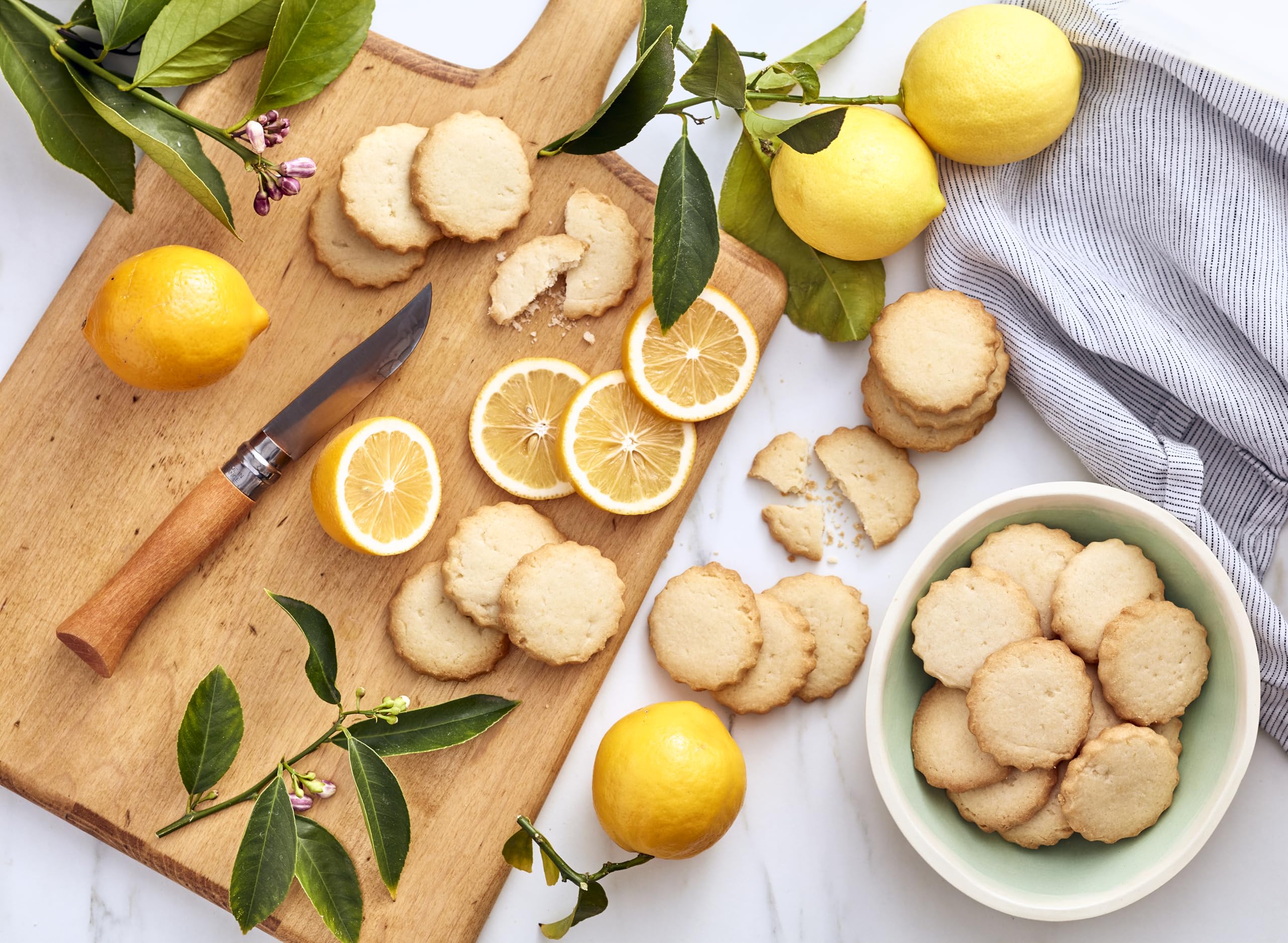 Fresh Meyer lemons and dough prep highlight bright citrus notes in Rustic Bakery.