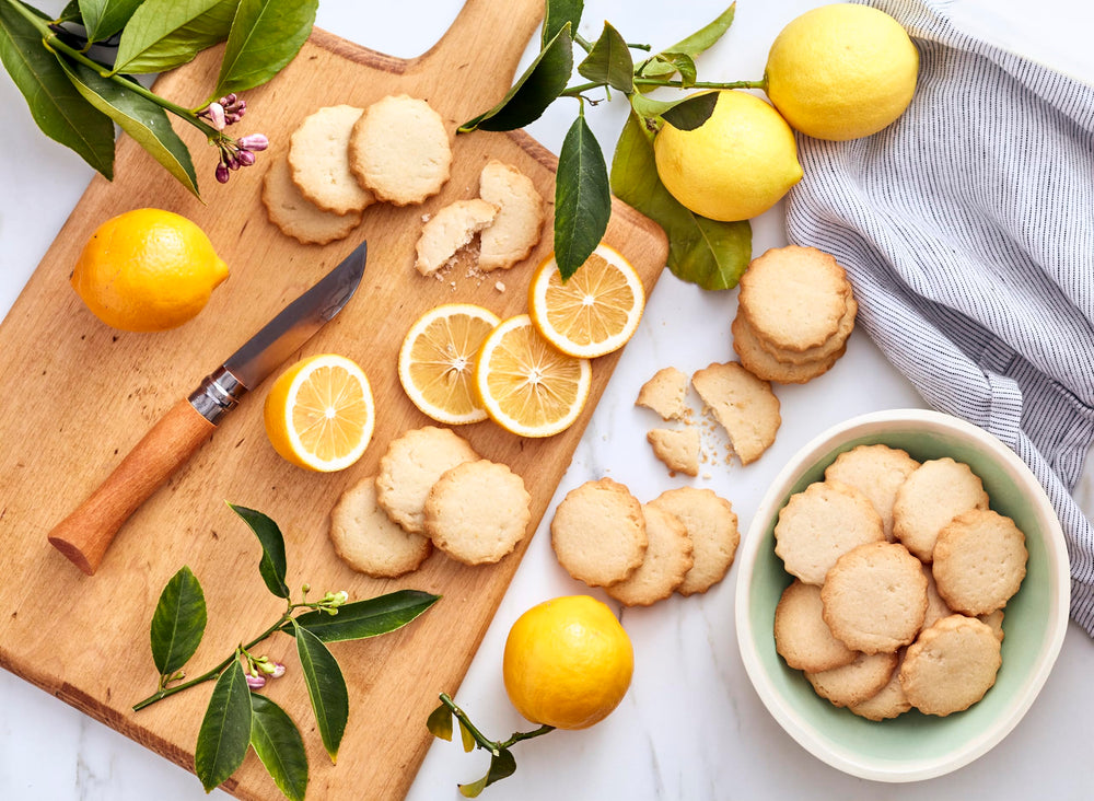 Fresh Meyer lemons and dough prep highlight bright citrus notes in Rustic Bakery.