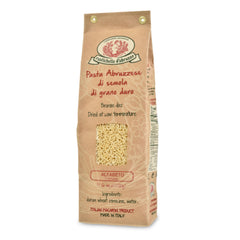 Rustichella d'Abruzzo Alfabeto pasta in brown bag for quick weeknight meals.