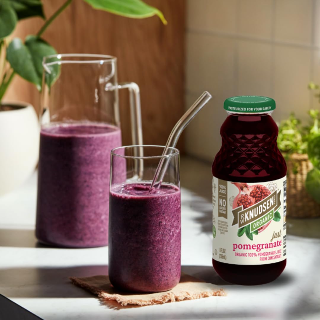 R.W. Knudsen Organic Pomegranate Juice in a glass, perfect for mocktails.